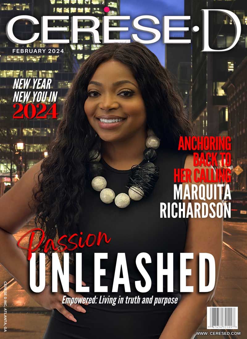 Smiling black woman standing in front of a night time cityscape wearing a black sleeveless dress and and a large beaded white and black necklace on a Cerese D magazine cover