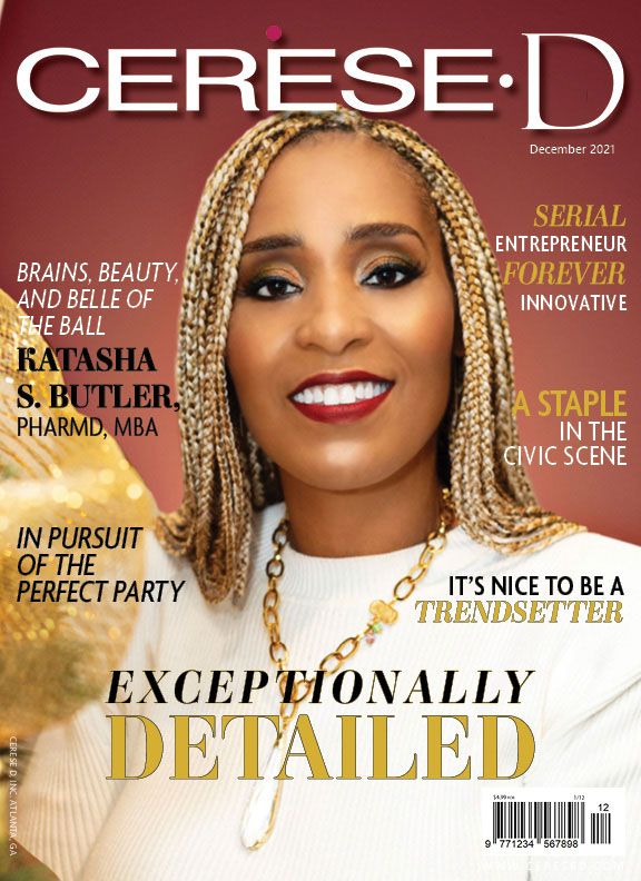 Dr. Katasha S. Butler smiling next to christmas decorations in a white sweater on Cerese D Magazine cover