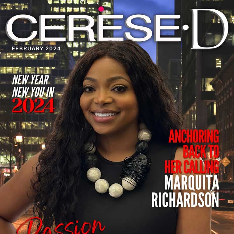 Smiling black woman standing in front of a night time cityscape wearing a black sleeveless top and and a large beaded white and black necklace on a Cerese D magazine cover