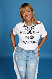 Sharon McDougle wearing Hidden figure no more tshirt and large necklace