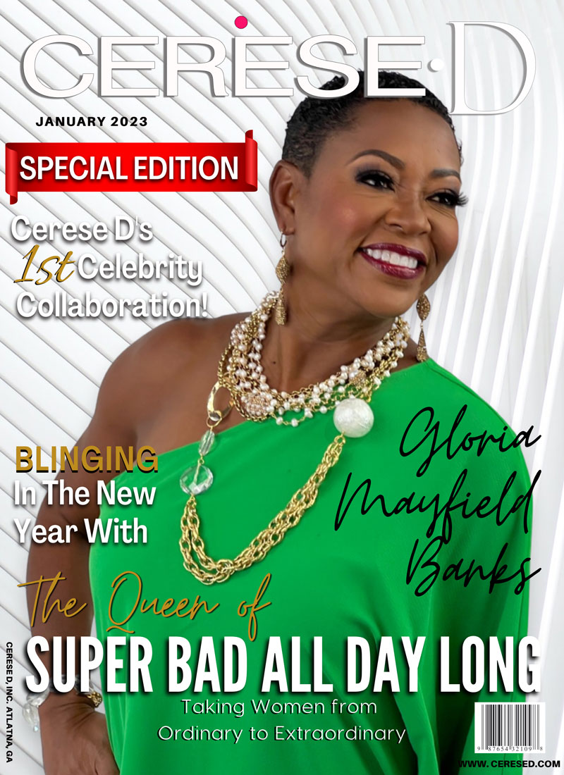 Image of a smiling woman named Gloria Mayfield Banks on a magazine cover wearing a bright green off the should top and multiple large chains necklaces with various white beads with a white swirly background